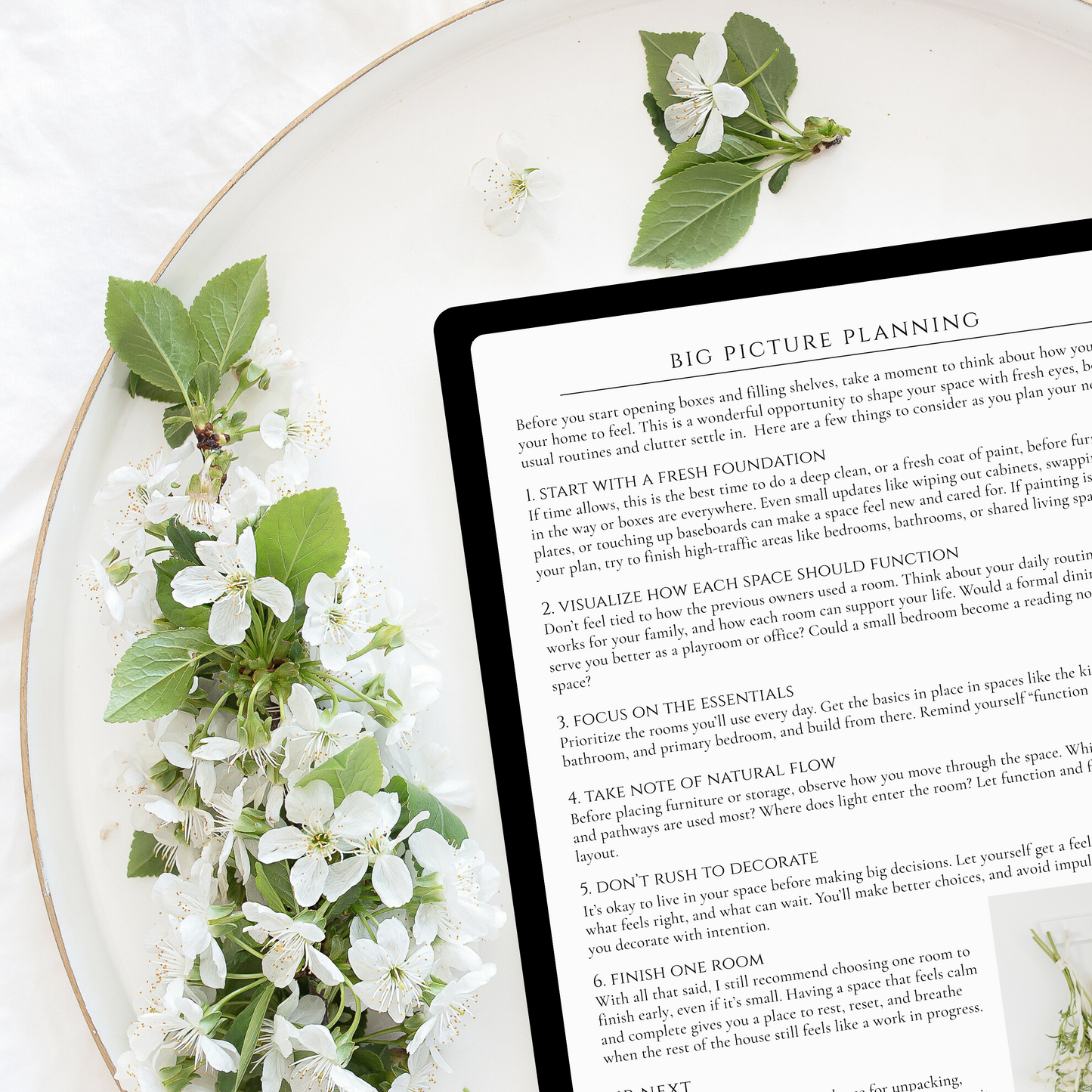 Digital Styling Guide shown on a tablet with floral accents, highlighting the practical guidance offered by Julia Wirth Interiors.